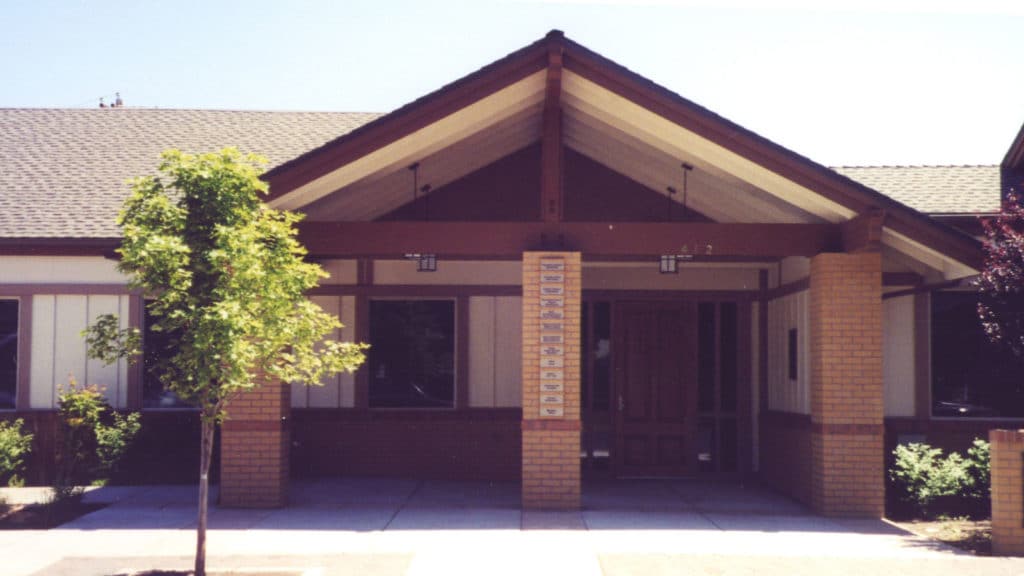 Image of Becky Johnson Community Center - a brick building with pitched roof at the entry.